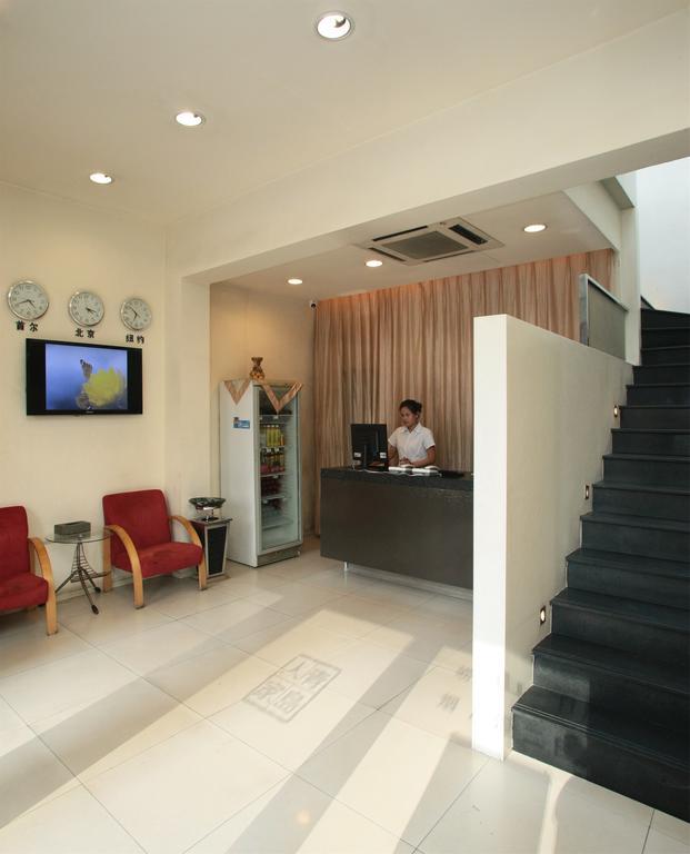 Qingdao Renjia Bussiness Hotel Bagian luar foto