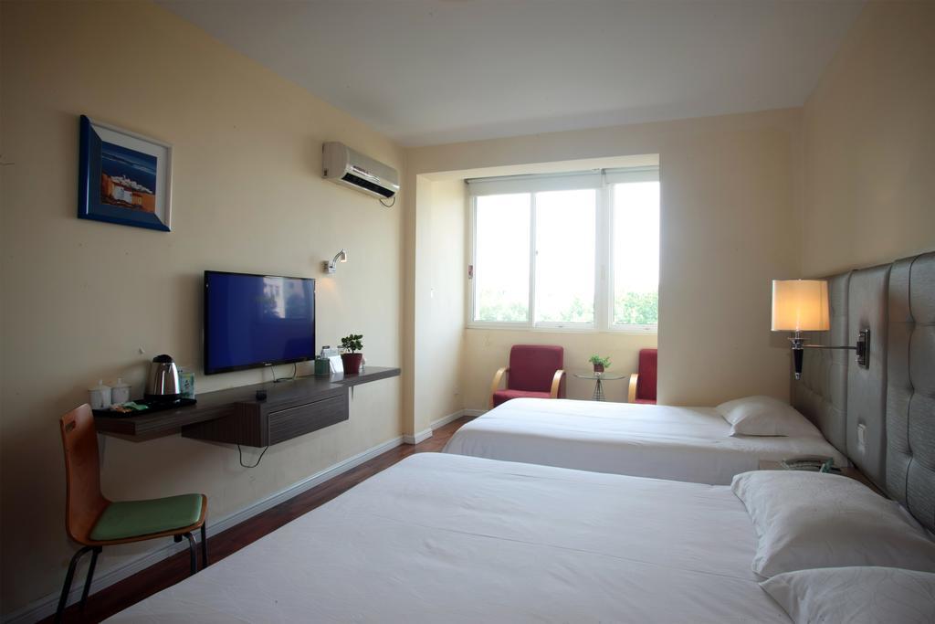 Qingdao Renjia Bussiness Hotel Bagian luar foto