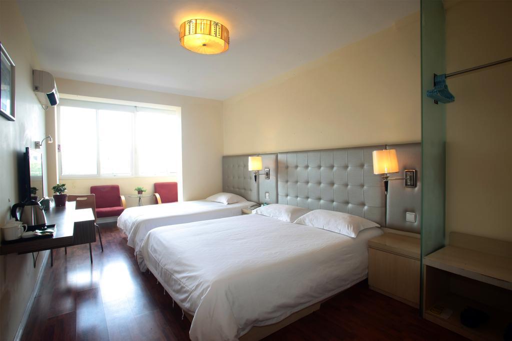 Qingdao Renjia Bussiness Hotel Bagian luar foto