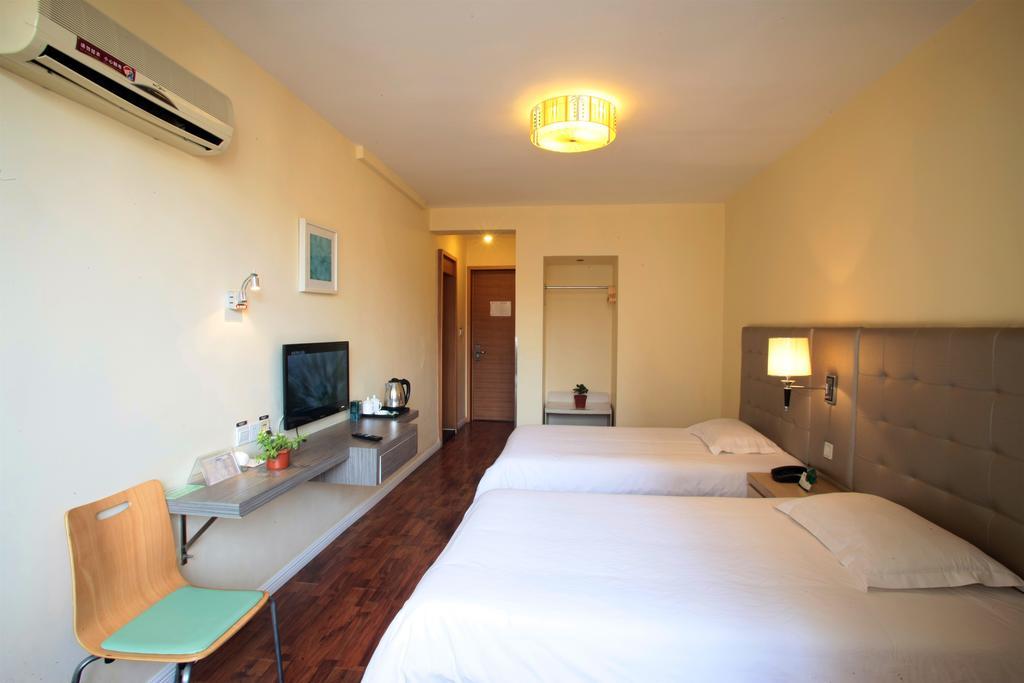 Qingdao Renjia Bussiness Hotel Bagian luar foto