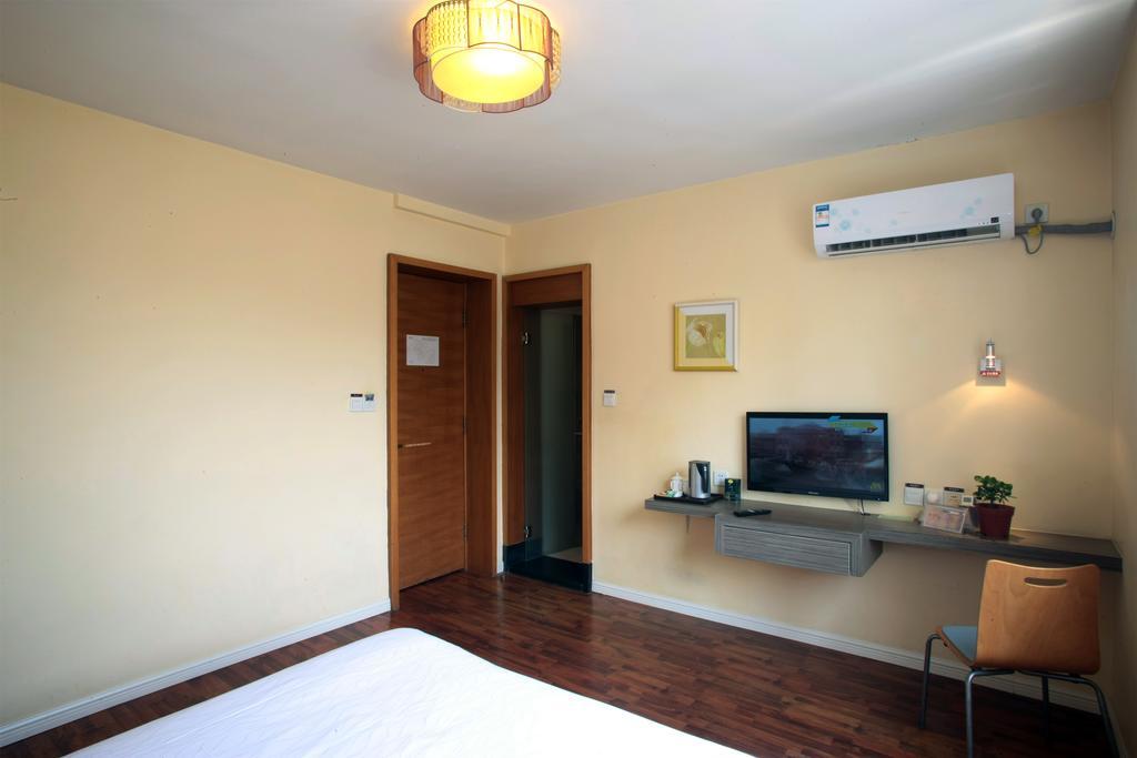 Qingdao Renjia Bussiness Hotel Bagian luar foto